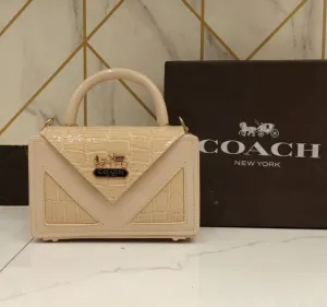 Coach Women's Handbag - Compact Size, Stylish Side Body (Beige/Peach)