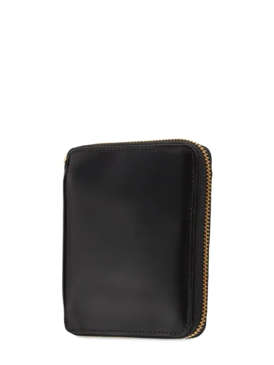 Comme des Garçons Wallet   Zip-up leather wallet 