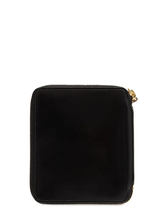 Comme des Garçons Wallet   Zip-up leather wallet 