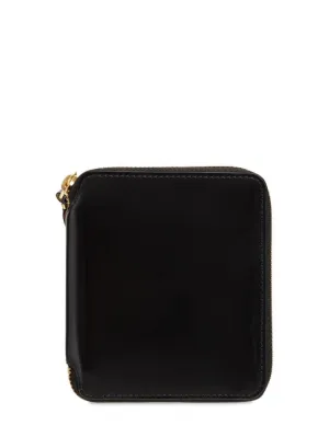 Comme des Garçons Wallet   Zip-up leather wallet 