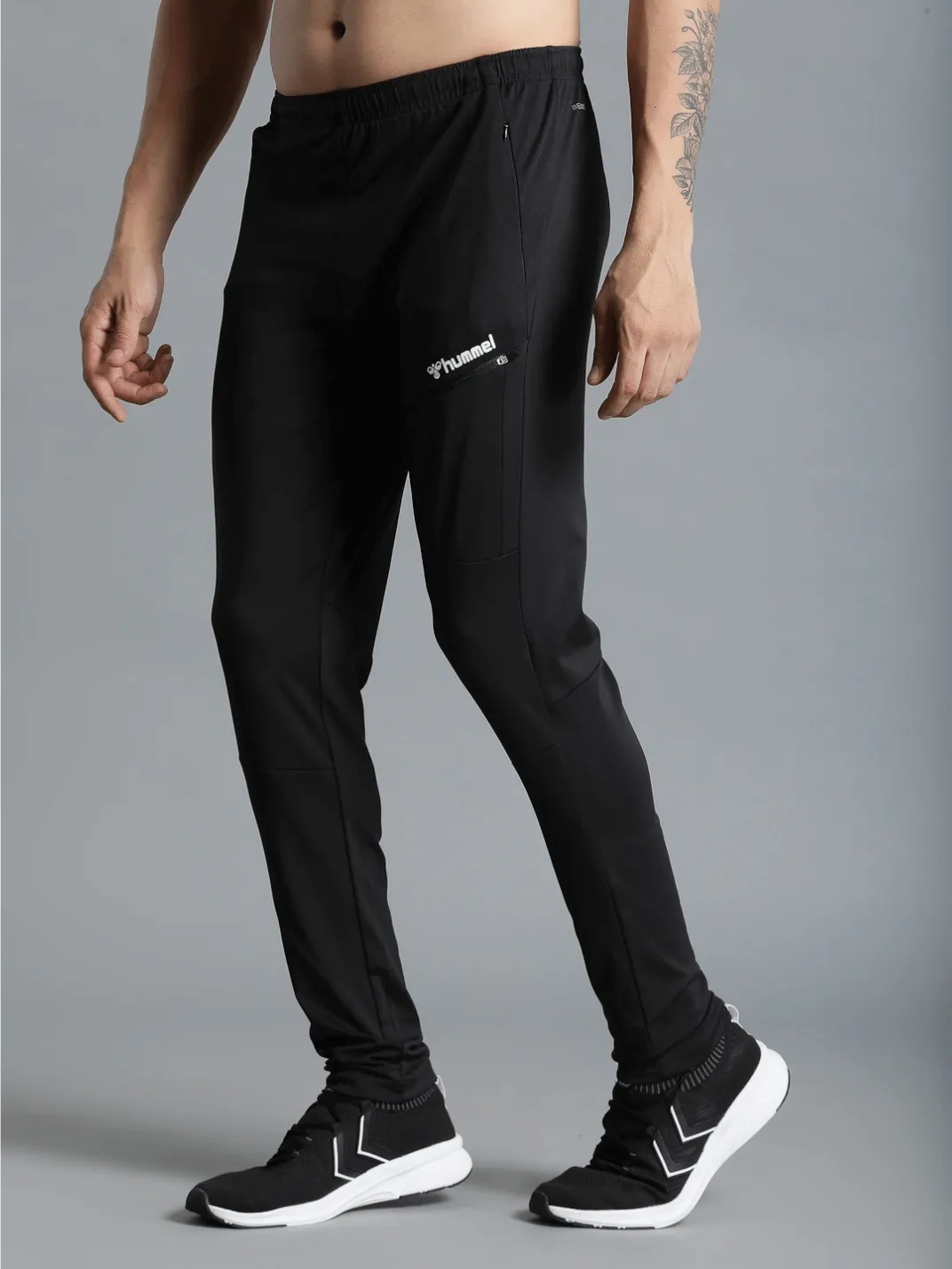 Football Solid Regular fit Polyester Trackpants for Men with zipper pockets Comfortable Breathable Fabric Stretchable for Everyday Use Ideal for Yoga Training Gym Running or Performance