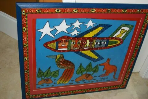 RARE UNIQUE COLORFUL  FOLK ART PAINTING PAPUA NEW GUINEA HUMOROUS ARTIST: TRIBAL WARRIORS TRAVELLING BY AIRPLANE & FRAMED IN SIGNED HAND PAINTED FRAME TO MATCH THE ART DESIGNER COLLECTOR WALL CARTOON  ART  26 1/2” by 23 1/2” HUGE DFP8