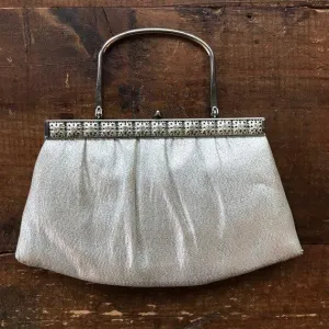 Vintage Silver Lame Clutch. Intricate Silver Tone Floral Hardware and Handle. Vintage Fashion.