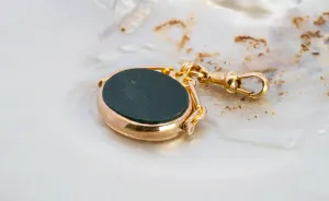 Yellow Gold Bloodstone Spinner Pendant - Unique and Captivating